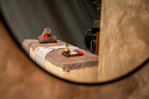 a reflection of a bed in a mirror at Bamboo Zanzibar in Jambiani