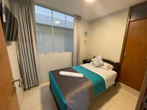 Voodi või voodid majutusasutuse Vianca Hotel toas