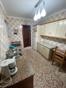 a kitchen with a sink and a counter top at Alojamiento Rural VivoBosque in El Bosque +10 photos