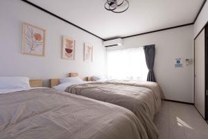 Letto o letti in una camera di Lino下伊福 岡山駅車で5分 無料駐車場 レストラン徒歩圏内多数
