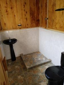 a bathroom with a sink and a toilet at Macheta Climbing House in Machetá