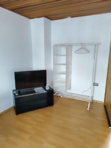 a room with a black desk in a room at Ferienwohnung Belvie 3 in Butzbach +43 photos