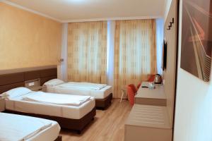 Postel nebo postele na pokoji v ubytování Isar City Hotel + 37 fotografií
