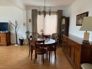 a dining room with a table and chairs at Apartment Linkerover- City Centre & Cathedral view in Antwerp