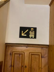 a sign on a wall above a wooden door at LAR DE SEFA in Redondela