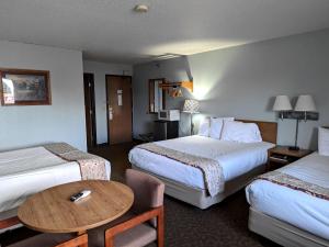 Voodi või voodid majutusasutuse Gettysburg Inn and Suites toas