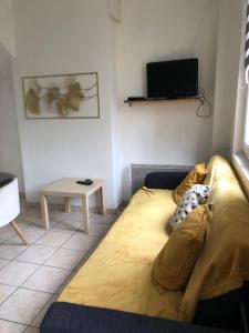 En eller flere senge i et værelse på Maison de ville