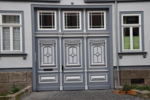a pair of garage doors on a house at Zur Pforte in Arnstadt