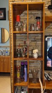 a book shelf filled with lots of glass jars at KINYANJUI HOMES OO2 in Morogoro