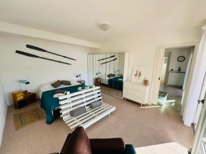 a bedroom with a bed and a mirror in a room at THERANCOBAY - lake view apartment - in Ranco