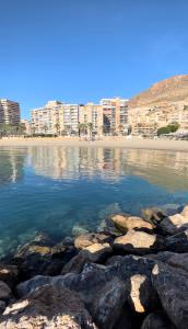 a view of a beach with buildings in the background at Brisas del Mar Mediterráneo in Aguadulce