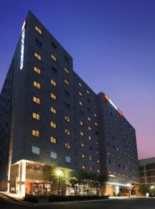 a large building with a clock on the side of it at ibis Ambassador Insadong in Seoul