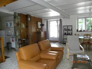 a living room with a couch and a table at Domaine de Pré Rond in La Faurie
