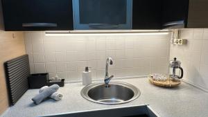 a kitchen counter top with a sink and a sink at Cómodo apartamento en El Palm mar in Palm-Mar +17 photos