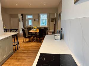 Kuchyň nebo kuchyňský kout v ubytování Arthur’s Cottage + 17 fotografií