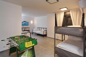 a room with two bunk beds and a chess board at וילה אליה in Migdal +46 photos