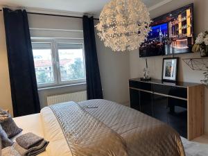 Posteľ alebo postele v izbe v ubytovaní Apartman Pannonica Pin 0-24h