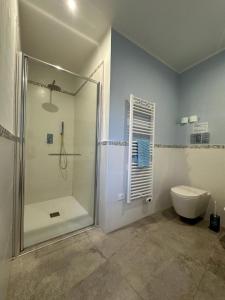 a bathroom with a shower and a toilet at Archè in Syracuse