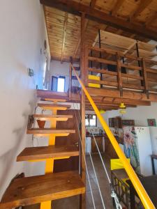 a set of wooden stairs in a room at Casita Alegre in Cafayate