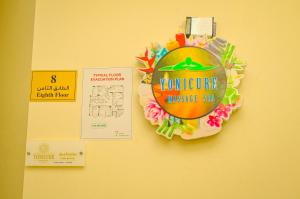 Um certificado, prémio, placa ou documento mostrado em GREEN GARDEN HOTEL