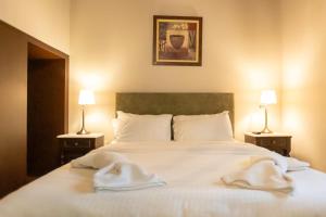 Postel nebo postele na pokoji v ubytování Guesthouse Lousios