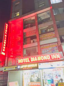 a hotel diamond inn sign in front of a building at Hotel Diamond inn @Esplanade in Kolkata