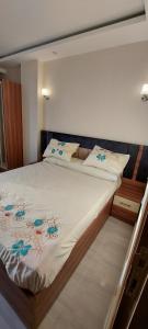 a large bed in a room with at Mirage Bay Hotel & Aqua Park , Suites in Hurghada