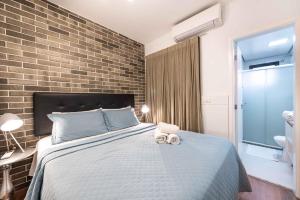 Ένα ή περισσότερα κρεβάτια σε δωμάτιο στο Rosemari's Apartments Sao Joao