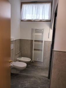 Koupelna v ubytování Appartamenti Donini Alfredo + 37 fotografií