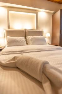 Postel nebo postele na pokoji v ubytování Guesthouse Lousios