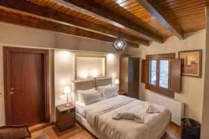 Postel nebo postele na pokoji v ubytování Guesthouse Lousios
