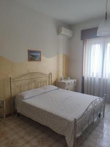 Postel nebo postele na pokoji v ubytování B&B Il Cedro