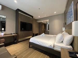 TV o dispositivi per l'intrattenimento presso Hotel A and A Quezon City powered by Cocotel