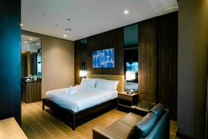Postel nebo postele na pokoji v ubytování Hotel A and A Quezon City powered by Cocotel + 37 fotografií