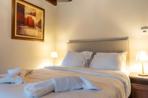 Postel nebo postele na pokoji v ubytování Guesthouse Lousios