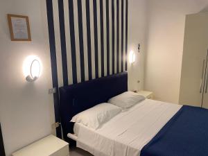 Postel nebo postele na pokoji v ubytování Hotel Vietri Coast