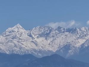 a large mountain range with snow covered mountains at Hotel Gogreen Kattike Pvt. Ltd. in Nagarkot