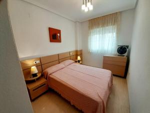 Postel nebo postele na pokoji v ubytování COSTA AZAHAR I DREAMS, Playa Amplaries