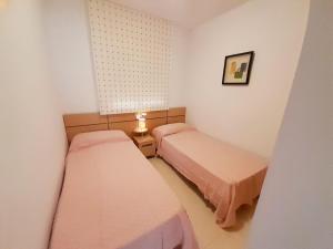 Postel nebo postele na pokoji v ubytování COSTA AZAHAR I DREAMS, Playa Amplaries
