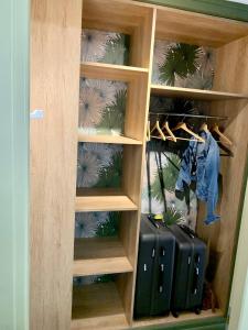 a walk in closet with suitcases in it at Côte & Mer. Studio 3 personnes bord de mer in Sangatte
