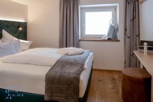 Voodi või voodid majutusasutuse Das Unterrain Lifestyle Hotel toas