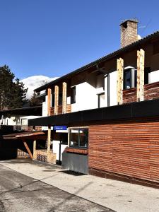 a building with a parking lot in front of it at RM-Apartments in Innsbruck