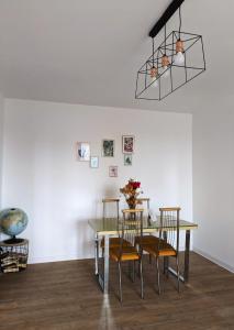 a dining room with a table and chairs at Old town apartment in Bucharest