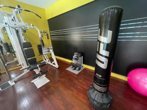 a room with a gym with a exercise machine at VILLA PUTRA CONDOMINIUM in Kuala Lumpur