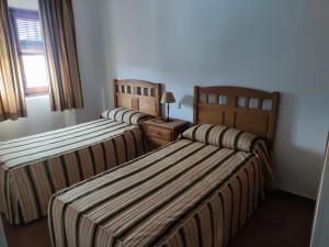 Ένα ή περισσότερα κρεβάτια σε δωμάτιο στο Casa Rural María Victoria