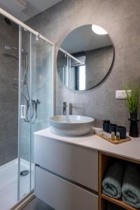 a bathroom with a sink and a mirror at Apartment EDIAS ONE in Banská Bystrica