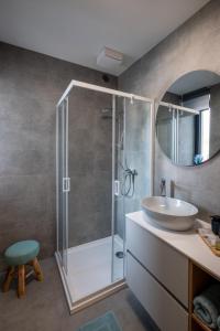a bathroom with a sink and a shower at Apartment EDIAS ONE in Banská Bystrica