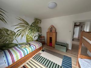 a bedroom with a bed and a small house at Zollhaus 26 in Hohegeiß