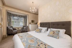 Ένα ή περισσότερα κρεβάτια σε δωμάτιο στο 2 Cambridge Villas B & B