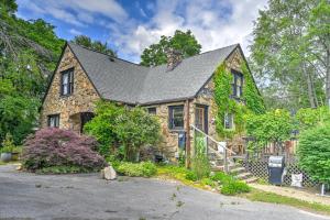 a stone house with a black roof at Asheville Urban Farmhouse Entire Home 4 mi to DT in Asheville